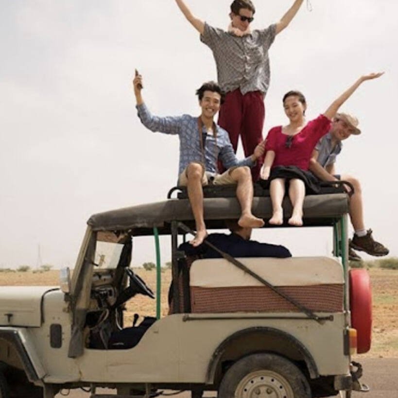 Tourist enjoying jeep safari in Jaisalmer desert at Sam Sand Dunes with thrilling off-road adventure experience